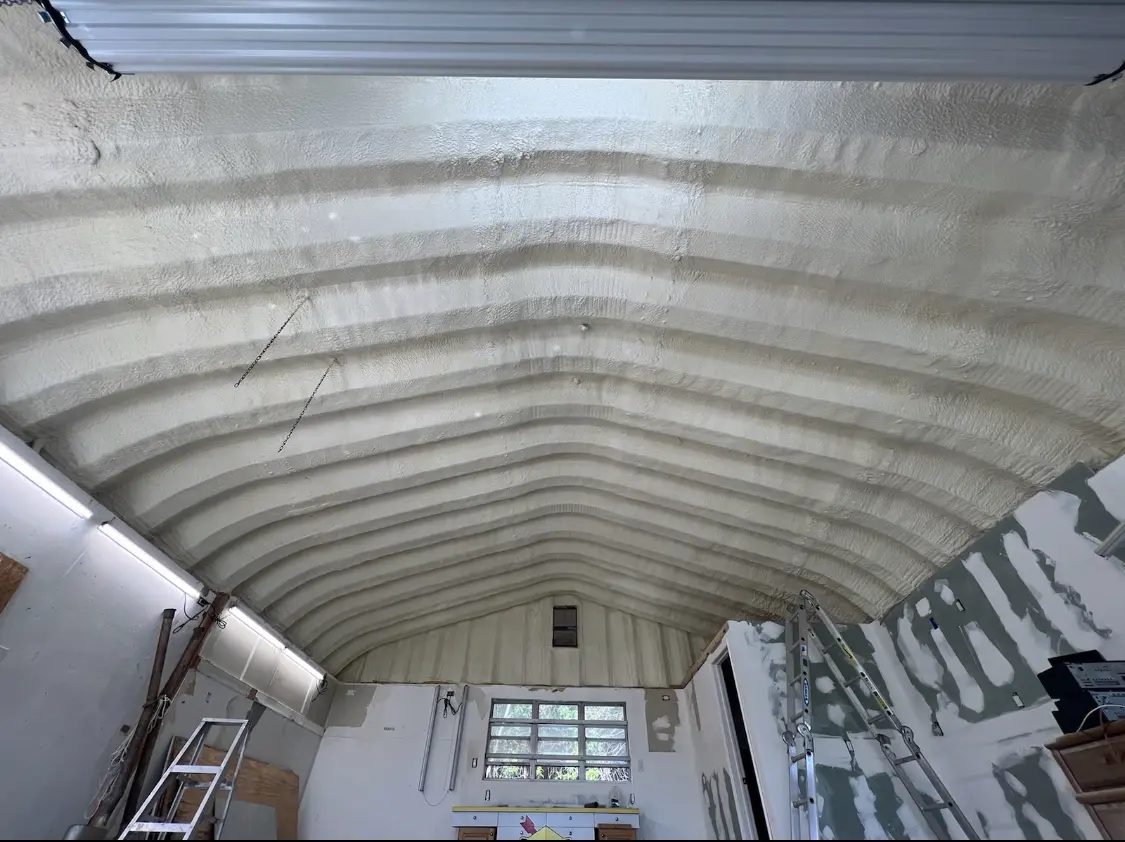Spray polyurethane foam applied to the underside of a metal roof deck in University City